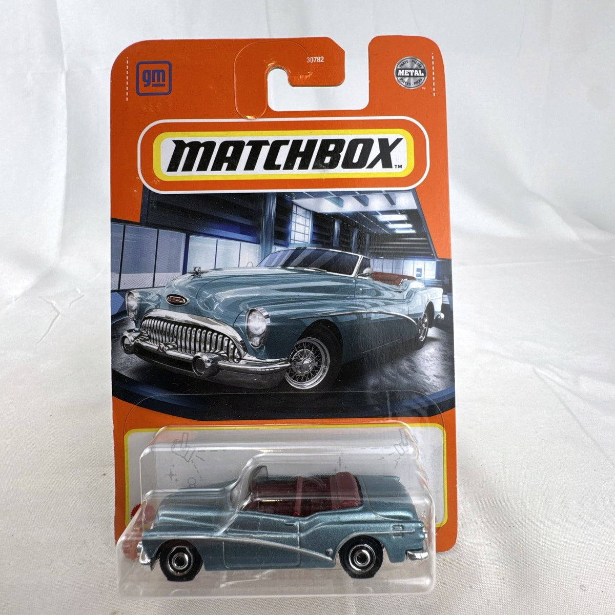 Matchbox 1:64 scale 1953 Buick Skylark Convertible in light metallic blue factory sealed on card.