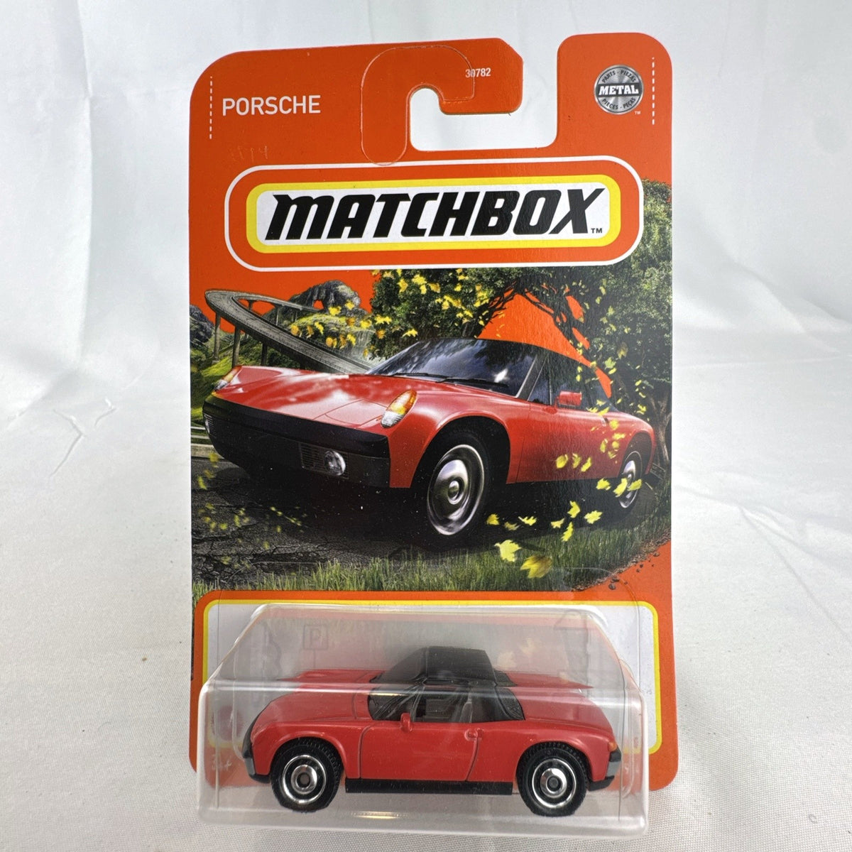 Matchbox 1:64 scale 1971 Porsche 914 diecast car in red with black targa top, sealed on original blister card.