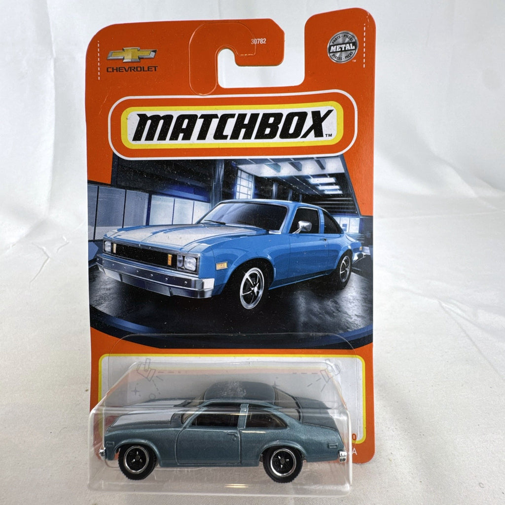 Matchbox 1:64 scale 1979 Chevrolet Nova diecast model car in metallic blue, sealed on original card.