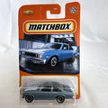 Matchbox 1:64 scale 1979 Chevrolet Nova diecast model car in metallic blue, sealed on original card.