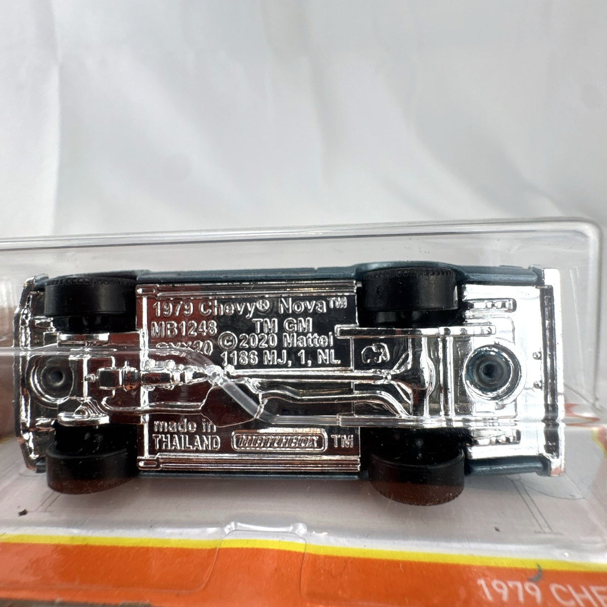 Matchbox 1:64 scale 1979 Chevrolet Nova diecast model car in metallic blue, sealed on original card.