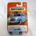 Matchbox 1:64 scale 1964 Austin Mini Cooper 1275S diecast car in light blue with checkered roof on original card