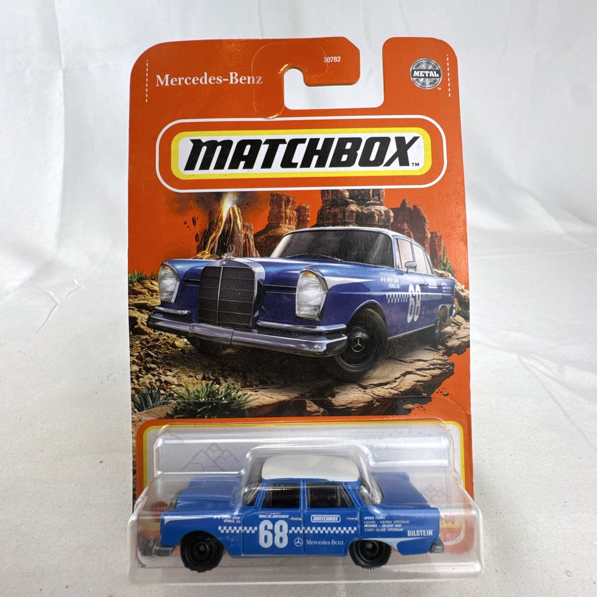 Matchbox 1:64 diecast 1962 Mercedes-Benz 220 SE rally car in blue on original sealed card packaging