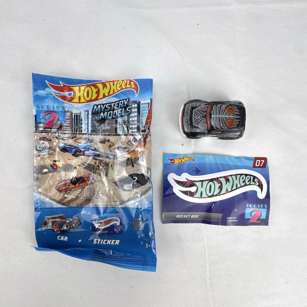 Hot Wheels Rocket Box #07 diecast car in black with pink and teal graphics from Mystery Models Series 2