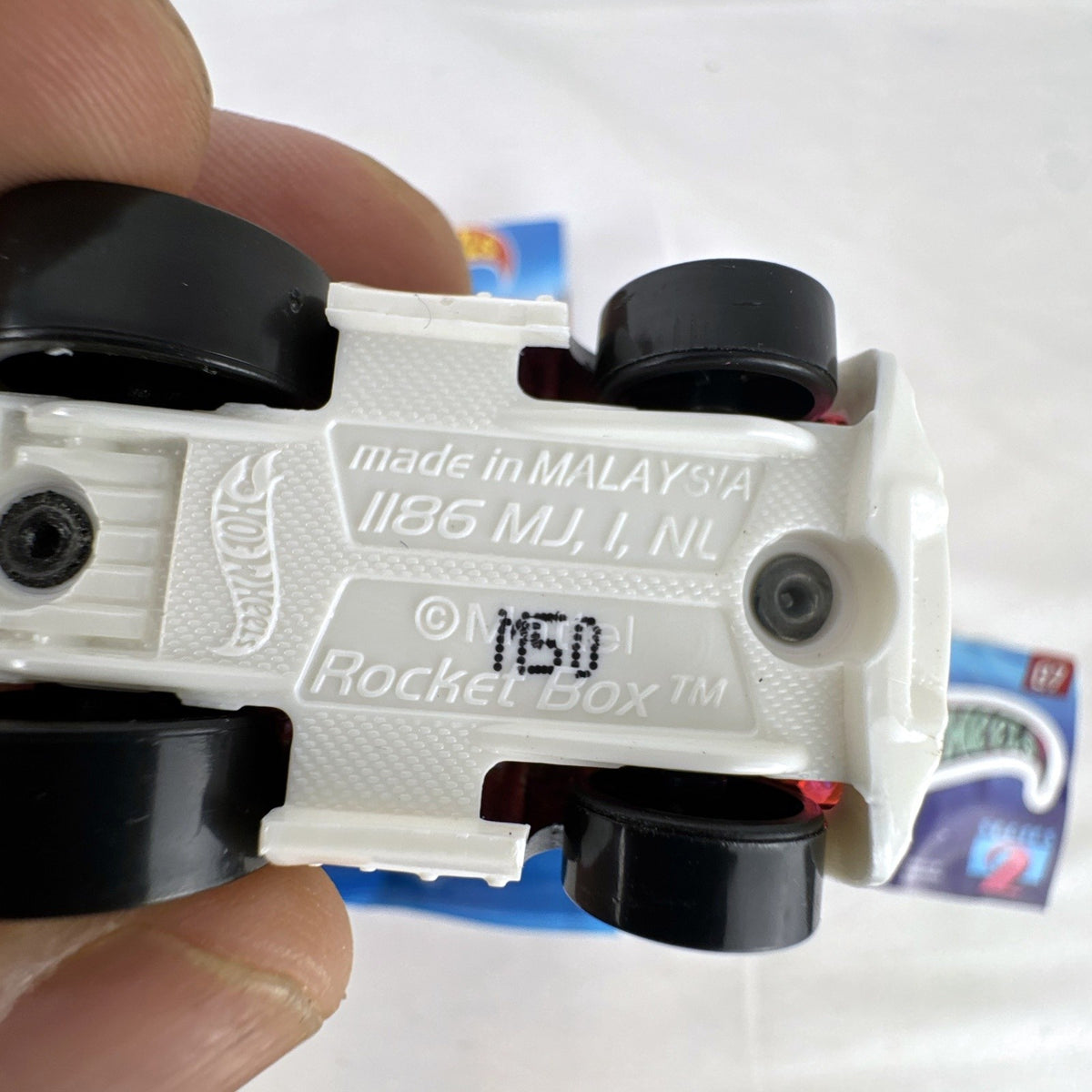 Hot Wheels Rocket Box #07 diecast car in black with pink and teal graphics from Mystery Models Series 2