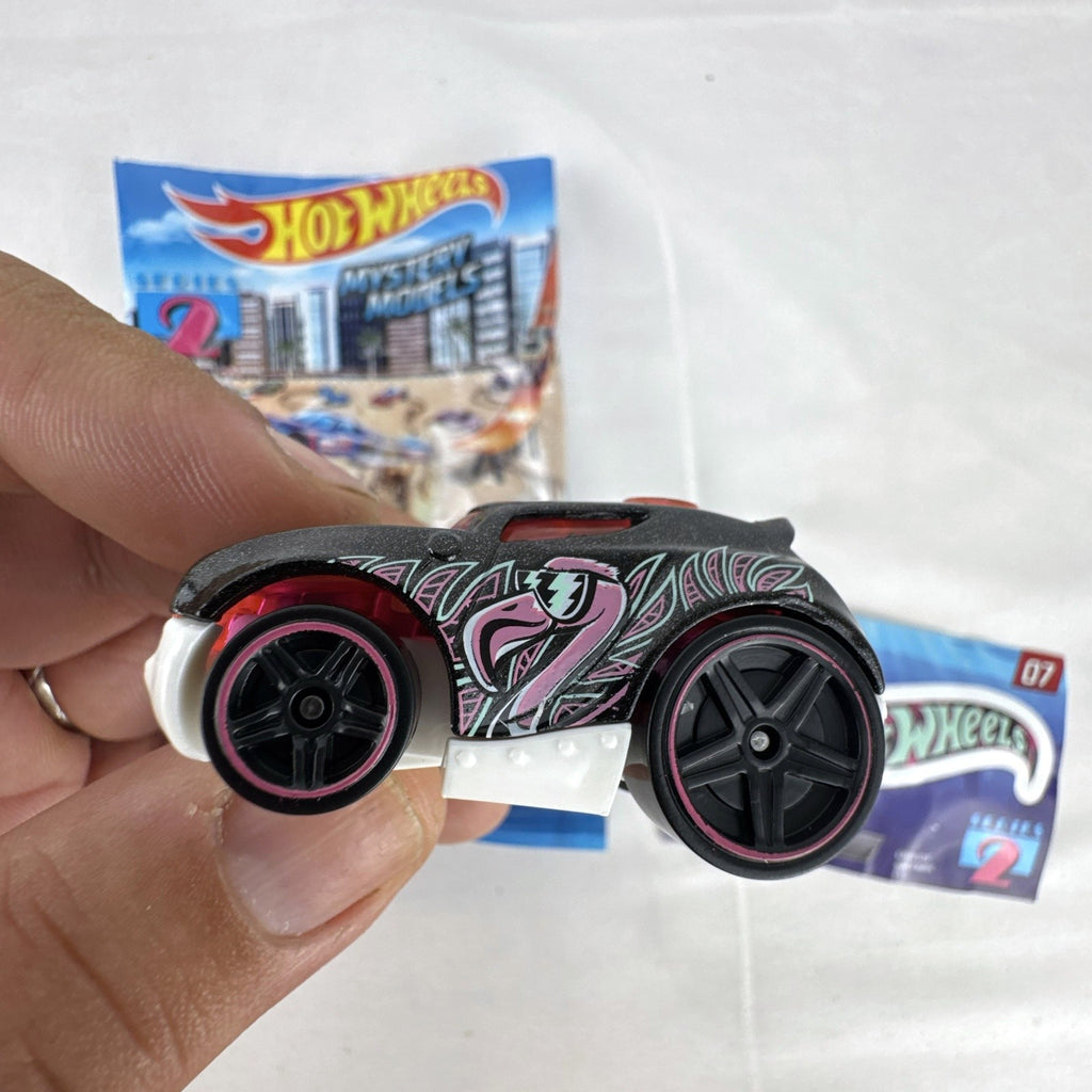 Hot Wheels Rocket Box #07 diecast car in black with pink and teal graphics from Mystery Models Series 2
