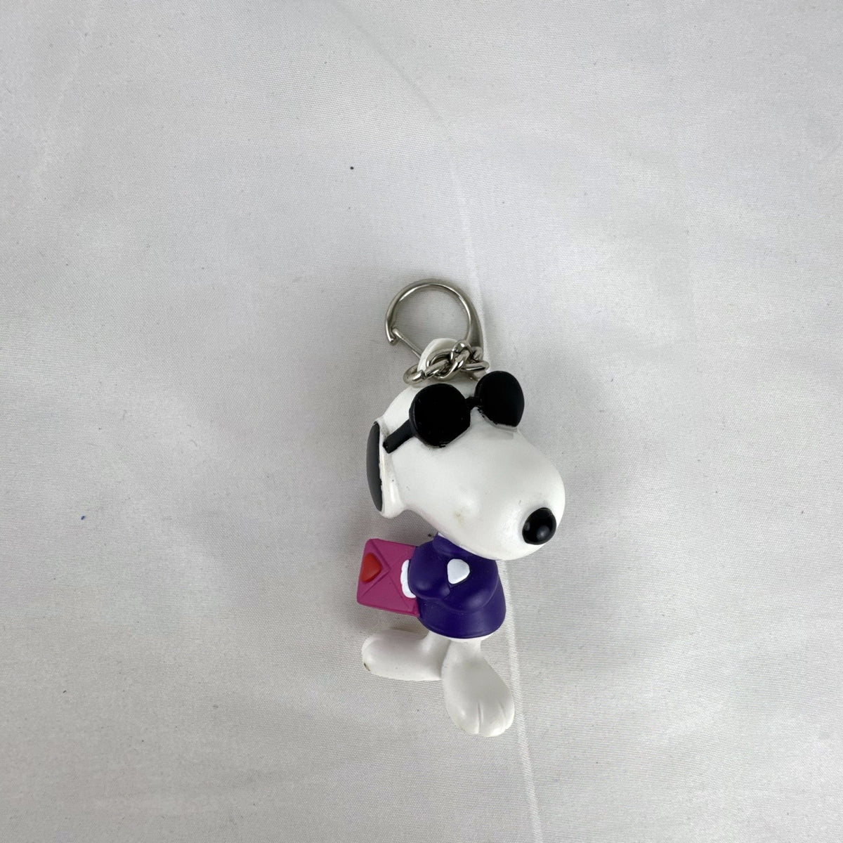Peanuts Snoopy Joe Cool plastic keychain figure with purple sweater, flip-up sunglasses, and Valentine envelope clip.