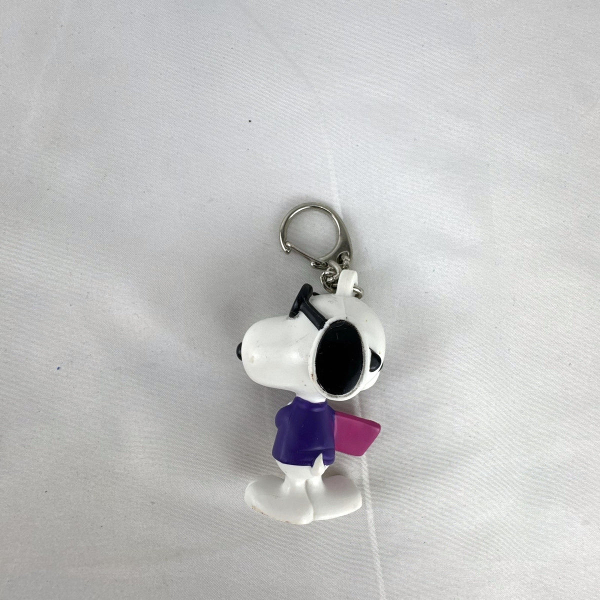 Peanuts Snoopy Joe Cool plastic keychain figure with purple sweater, flip-up sunglasses, and Valentine envelope clip.