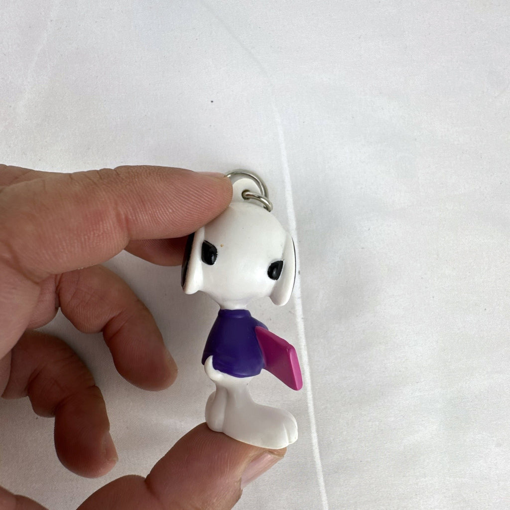 Peanuts Snoopy Joe Cool plastic keychain figure with purple sweater, flip-up sunglasses, and Valentine envelope clip.