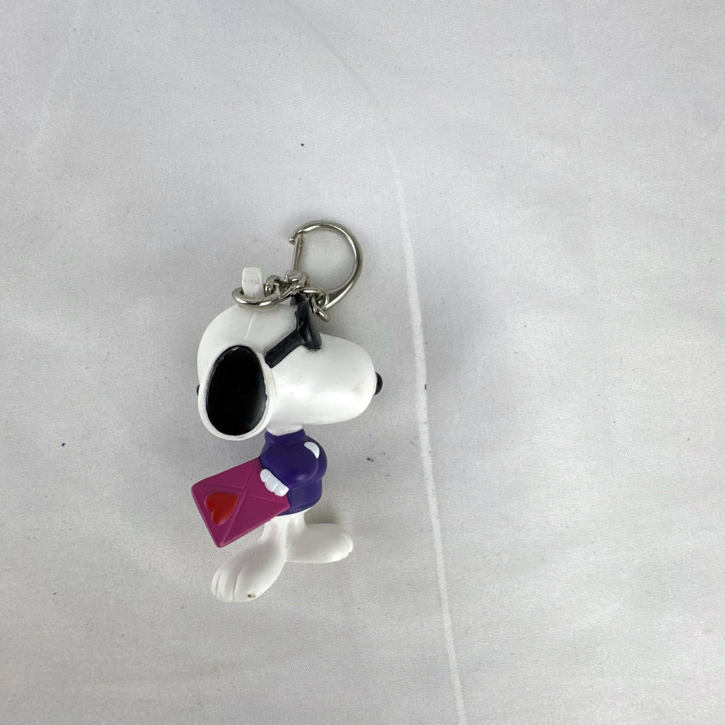 Peanuts Snoopy Joe Cool plastic keychain figure with purple sweater, flip-up sunglasses, and Valentine envelope clip.