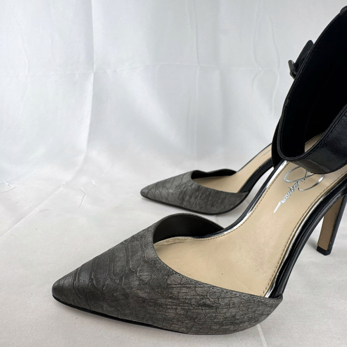 Jessica Simpson gray snake print d'Orsay pumps with black ankle straps, size 8.