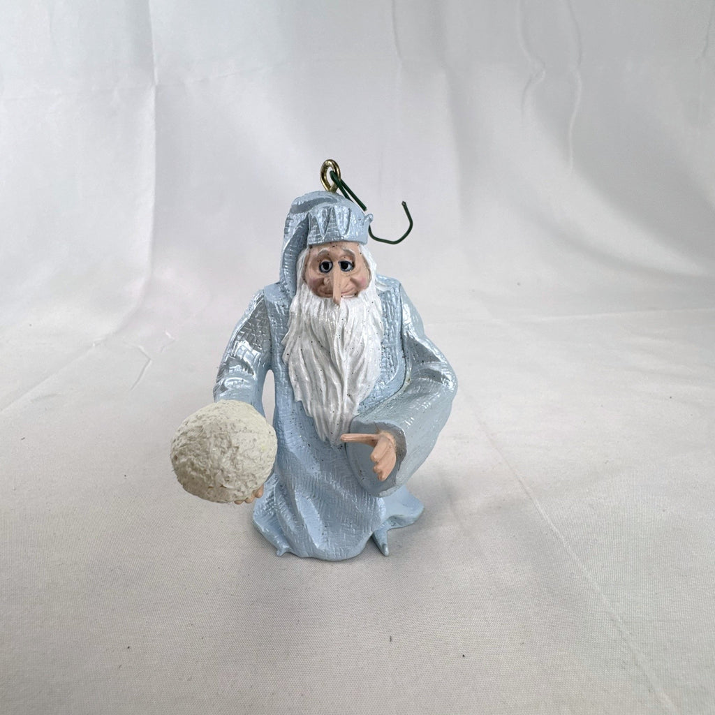 Vintage light blue winter wizard resin Christmas ornament holding a snowball