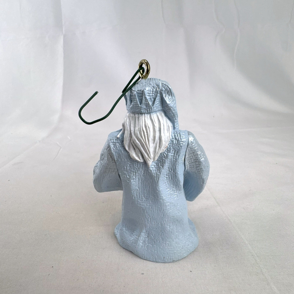 Vintage light blue winter wizard resin Christmas ornament holding a snowball
