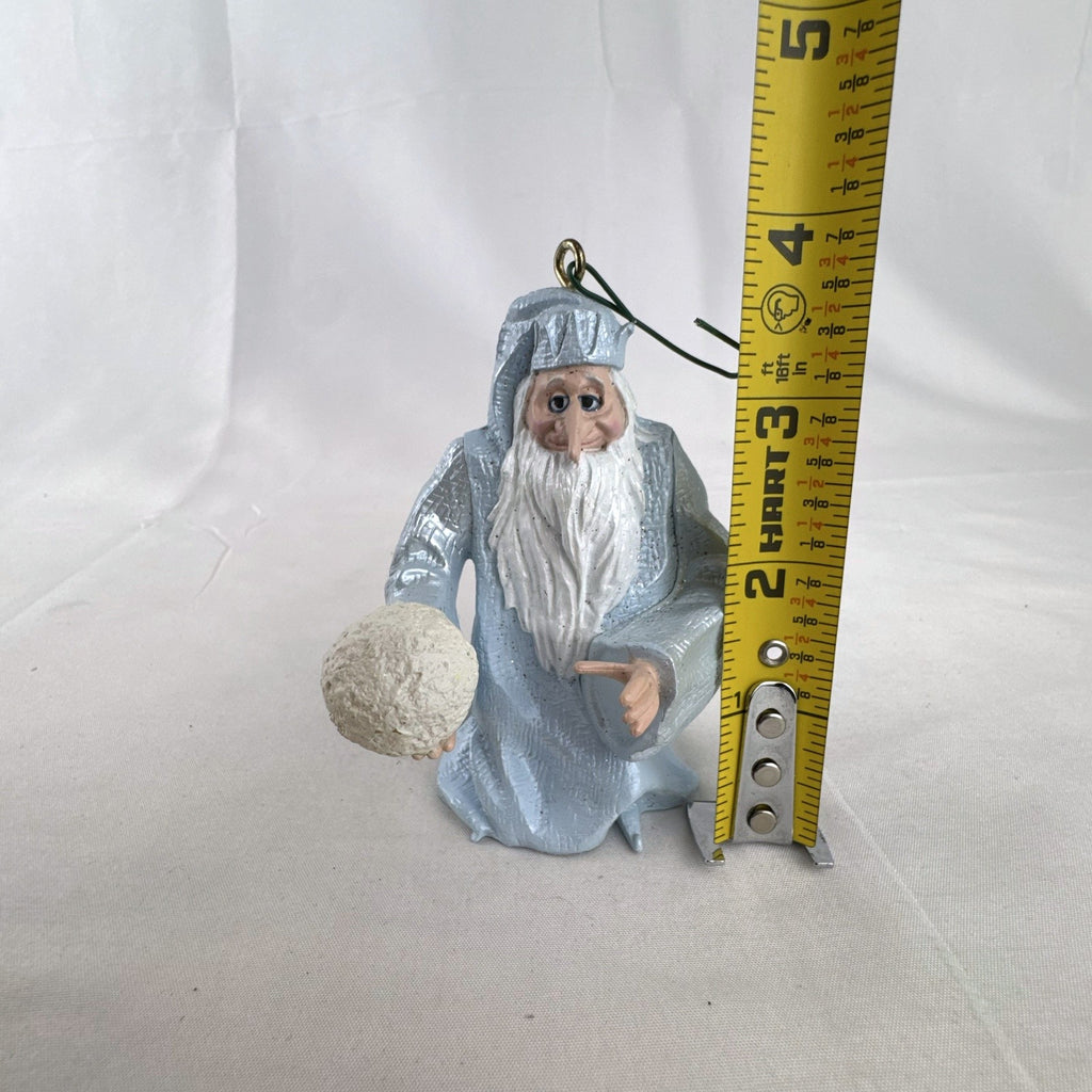 Vintage light blue winter wizard resin Christmas ornament holding a snowball