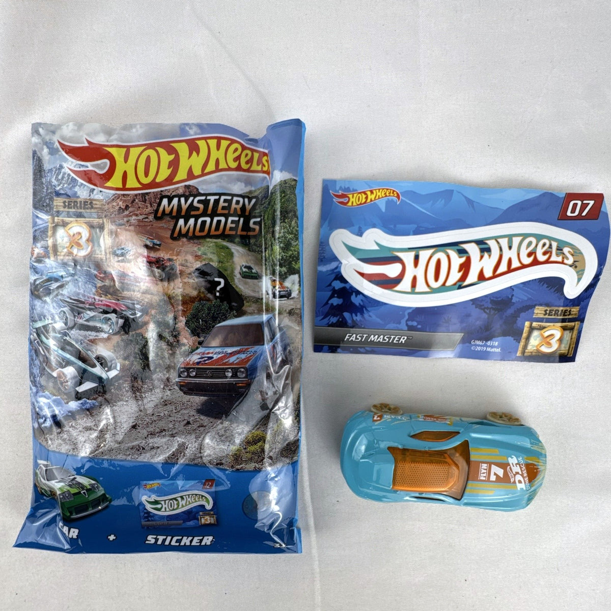 Hot Wheels Fast Master 1:64 scale light blue diecast car with Dune Rescue livery and orange windows