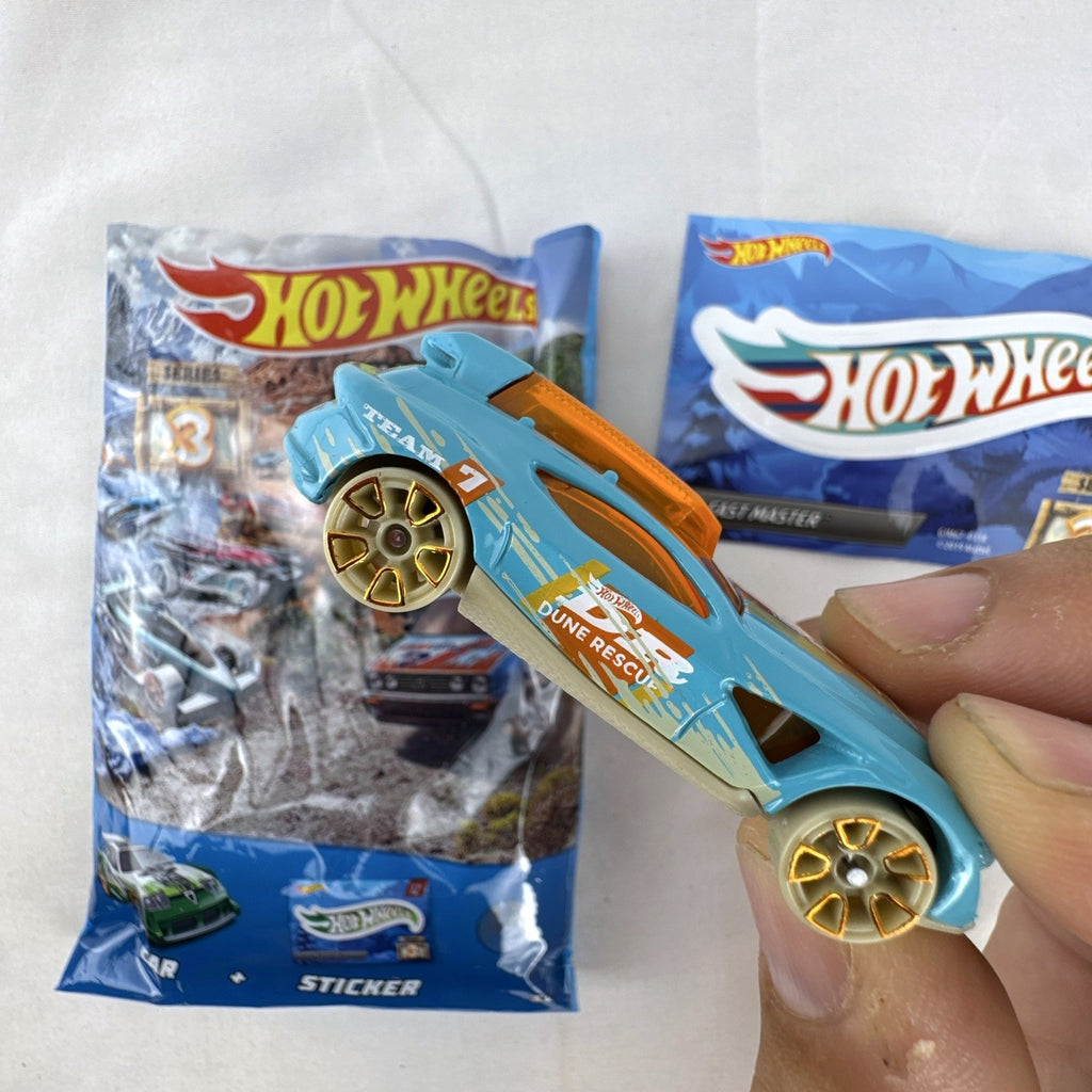 Hot Wheels Fast Master 1:64 scale light blue diecast car with Dune Rescue livery and orange windows