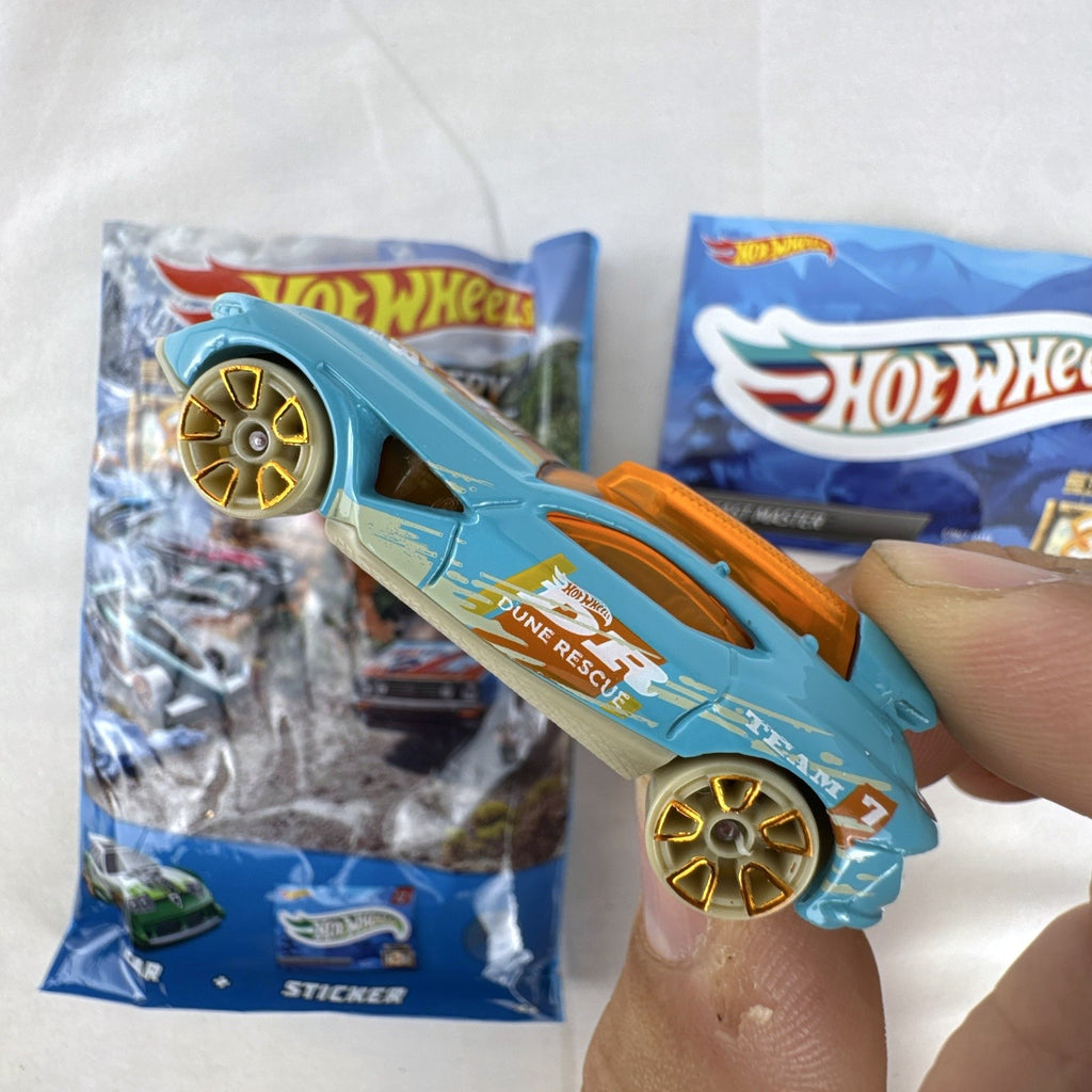 Hot Wheels Fast Master 1:64 scale light blue diecast car with Dune Rescue livery and orange windows