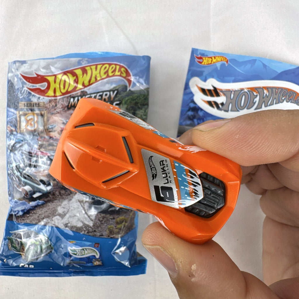 Hot Wheels 1:64 scale RD-03 diecast car in bright orange from Mystery Models Series 3 with original sticker
