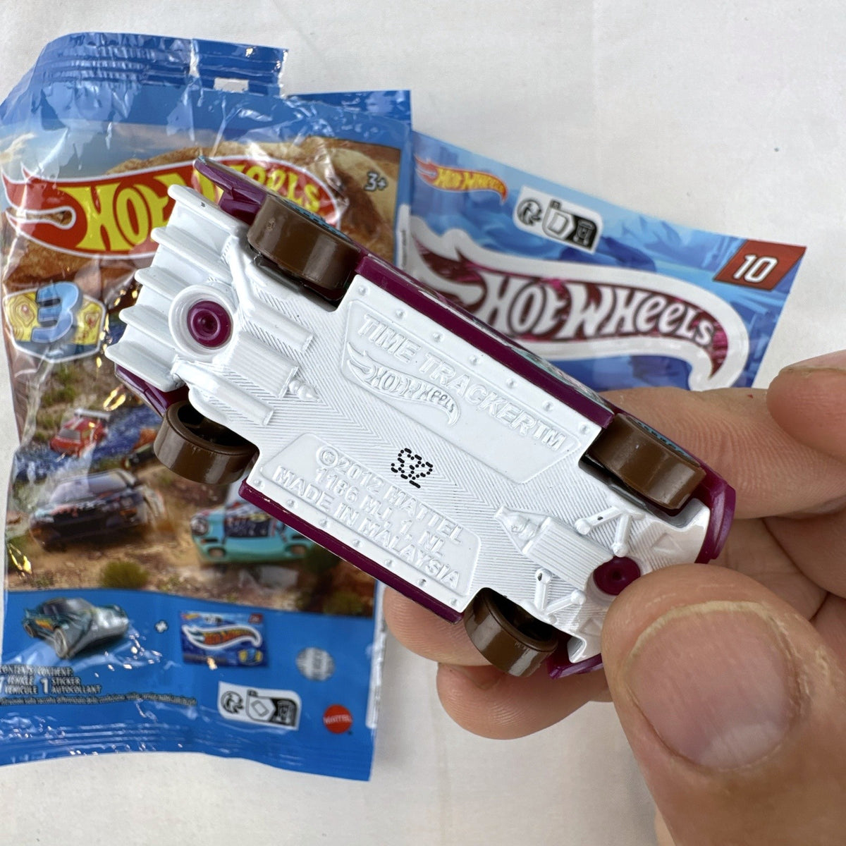 Hot Wheels Time Tracker 1:64 scale purple diecast car from 2022 Mystery Models Series 3