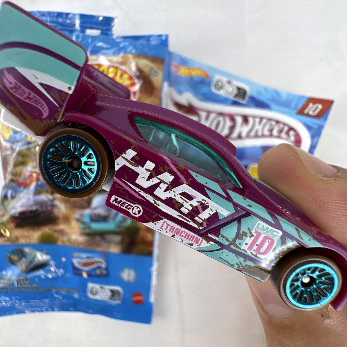 Hot Wheels Time Tracker 1:64 scale purple diecast car from 2022 Mystery Models Series 3