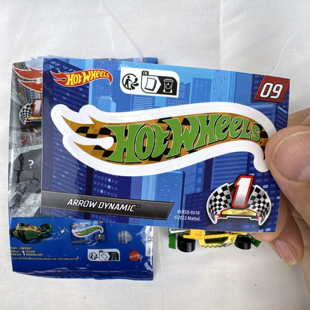 Yellow and green Hot Wheels Arrow Dynamic #09 Mystery Models 1:64 scale diecast car with original sticker card.