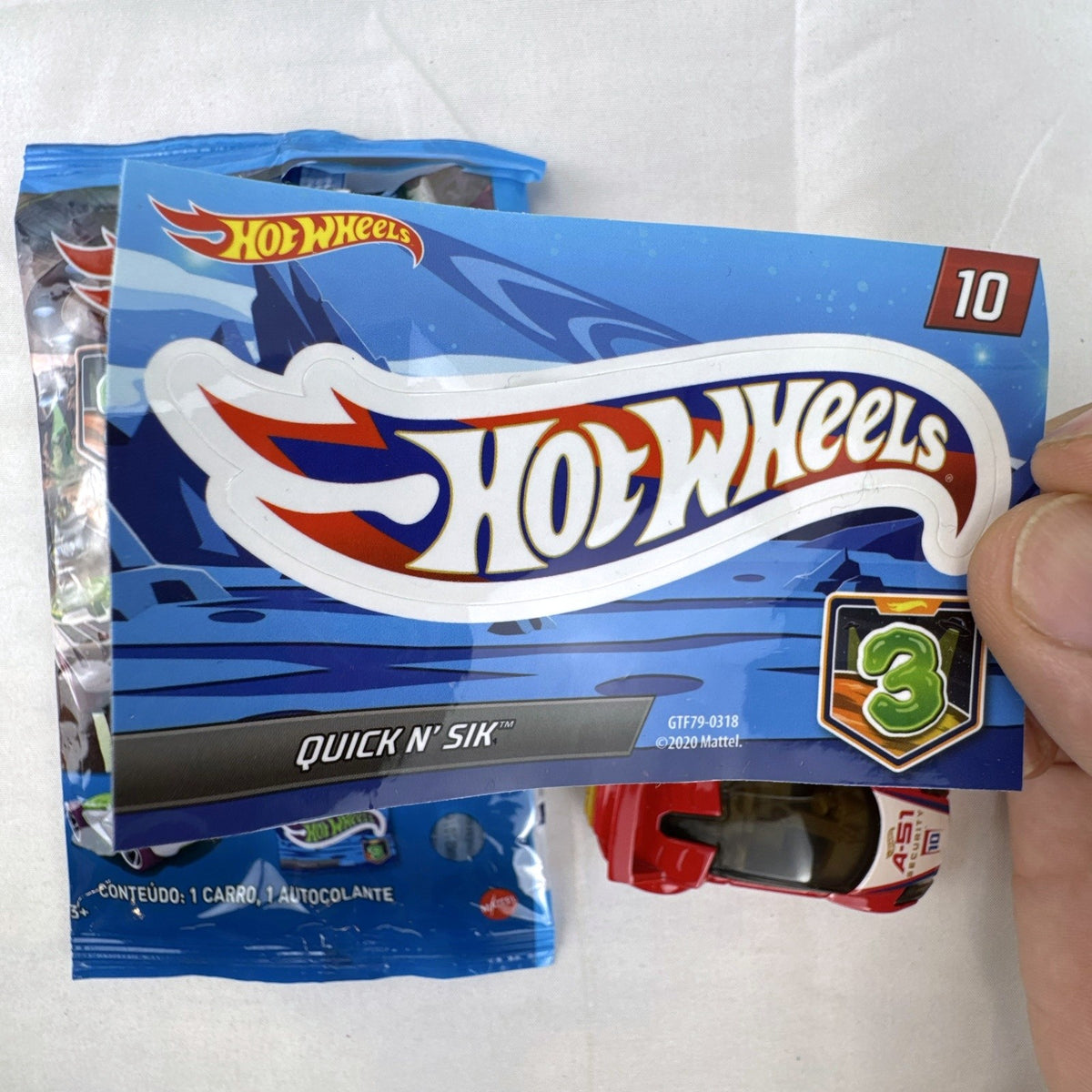 Hot Wheels 1:64 Quick N' Sik diecast car in red with A-51 Security livery from Mystery Models Series 3