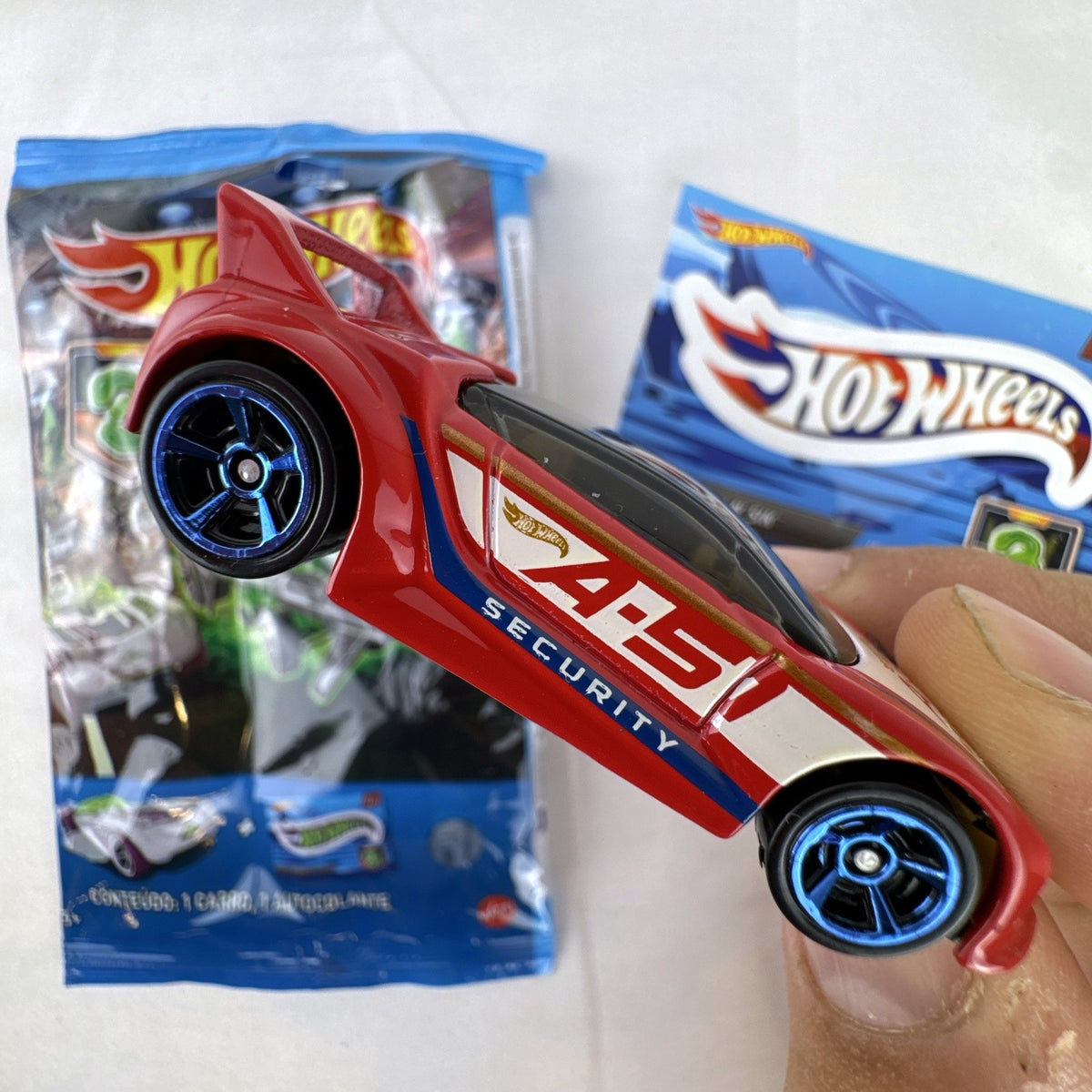 Hot Wheels 1:64 Quick N' Sik diecast car in red with A-51 Security livery from Mystery Models Series 3
