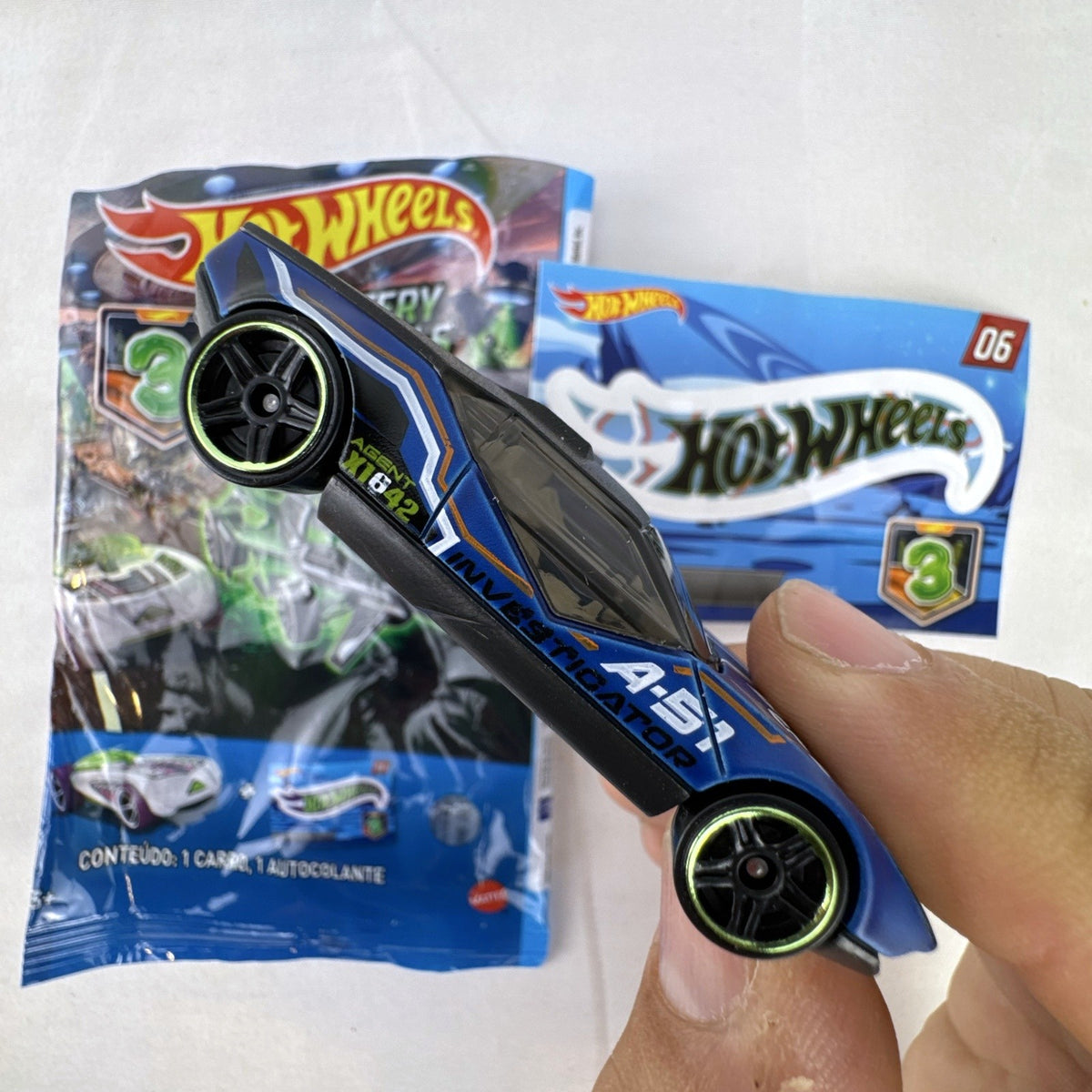 Hot Wheels La Fasta 1:64 diecast car in blue with A-51 Investigator graphics from Mystery Models Series 3 with sticker sheet