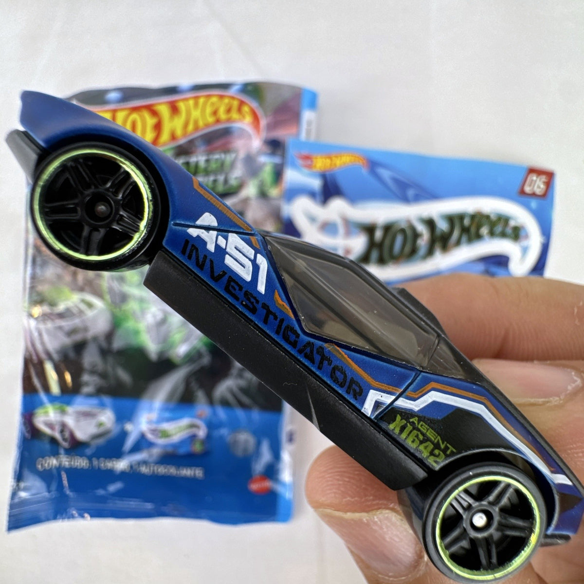 Hot Wheels La Fasta 1:64 diecast car in blue with A-51 Investigator graphics from Mystery Models Series 3 with sticker sheet