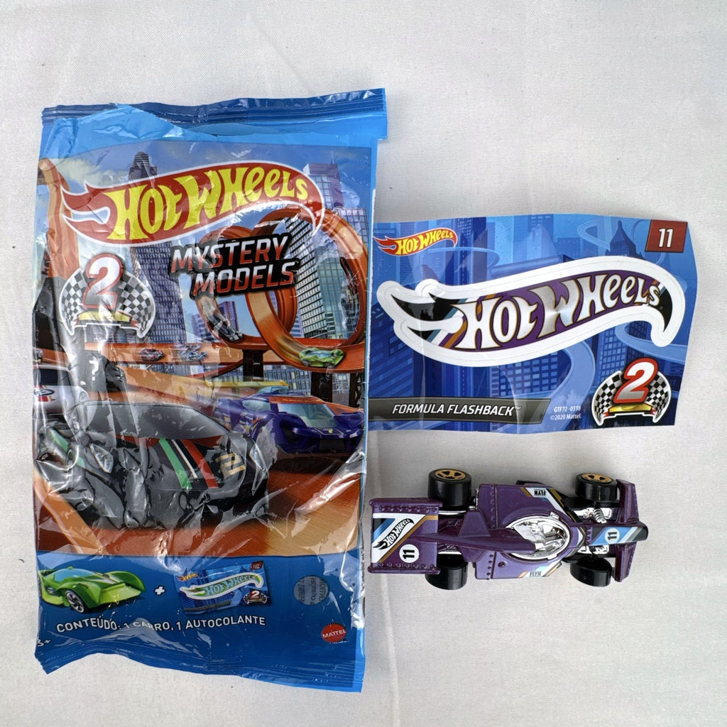 Hot Wheels Formula Flashback 1:64 scale purple diecast racer with gold wheels and matching sticker.