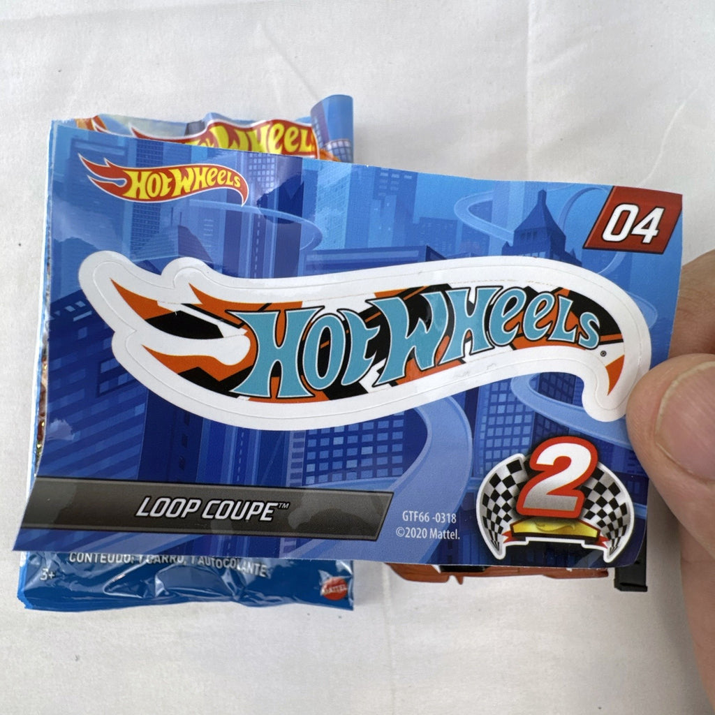 Hot Wheels 1:64 scale Loop Coupe diecast car in satin brown with HW Racing graphics and original foil packaging.