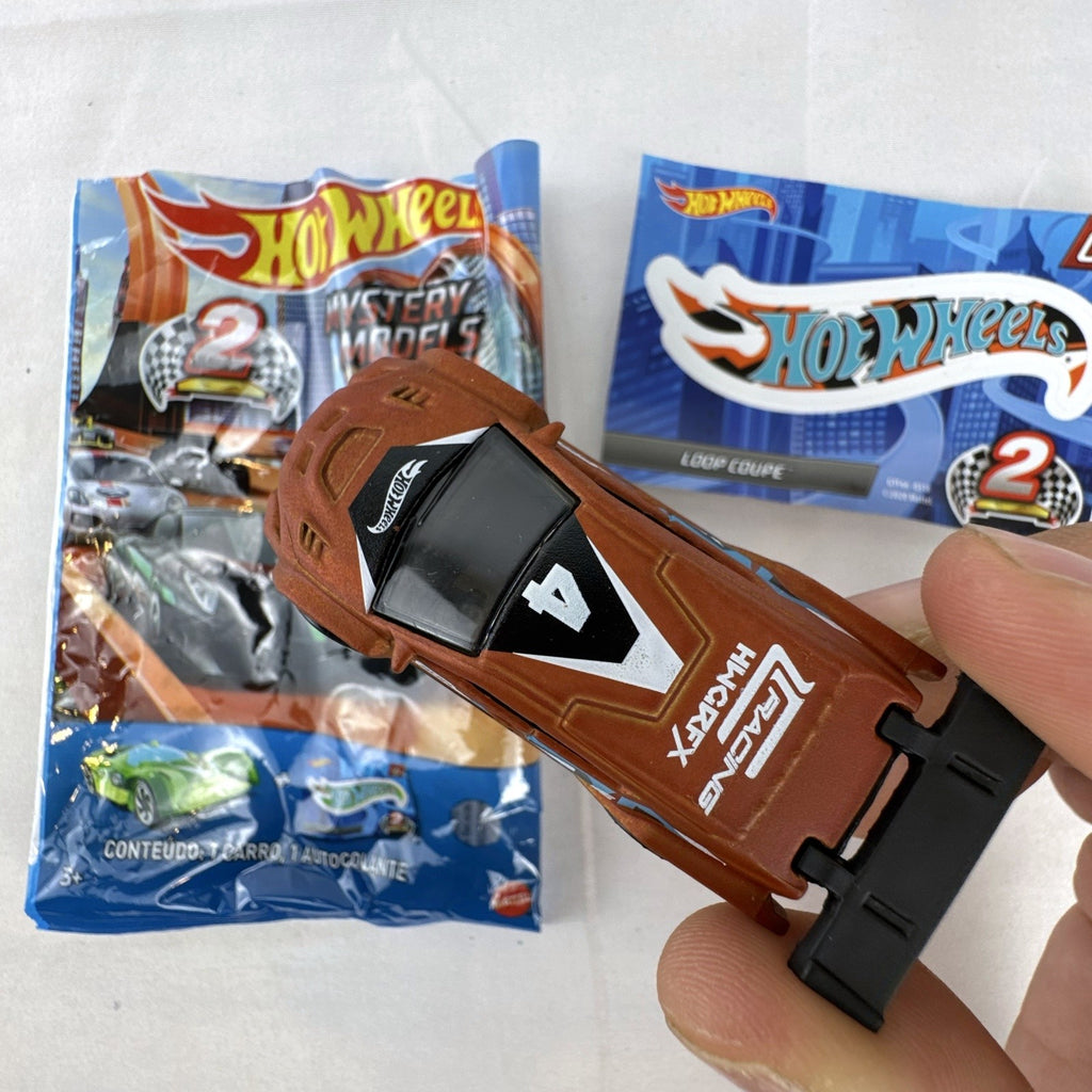 Hot Wheels 1:64 scale Loop Coupe diecast car in satin brown with HW Racing graphics and original foil packaging.