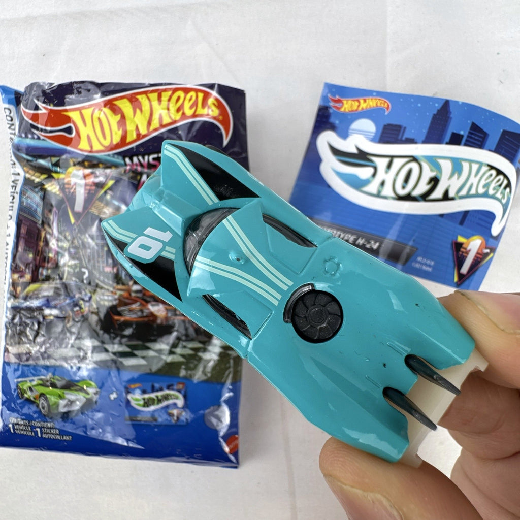 Teal Hot Wheels Prototype H-24 diecast 1:64 scale car with number 10 racing graphics and white 5-spoke wheels.