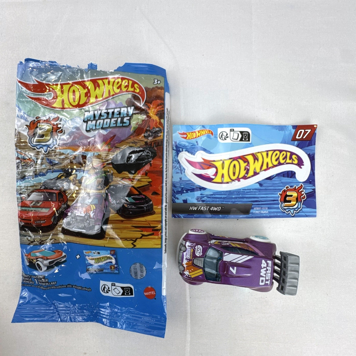 Hot Wheels 1:64 scale Fast 4WD diecast car in metallic purple from Mystery Models Series 3 with original packaging