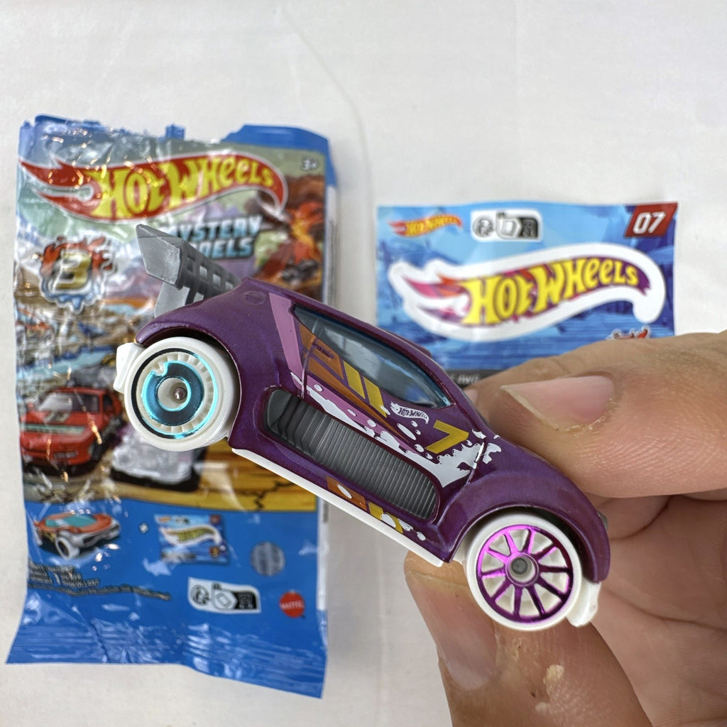 Hot Wheels 1:64 scale Fast 4WD diecast car in metallic purple from Mystery Models Series 3 with original packaging