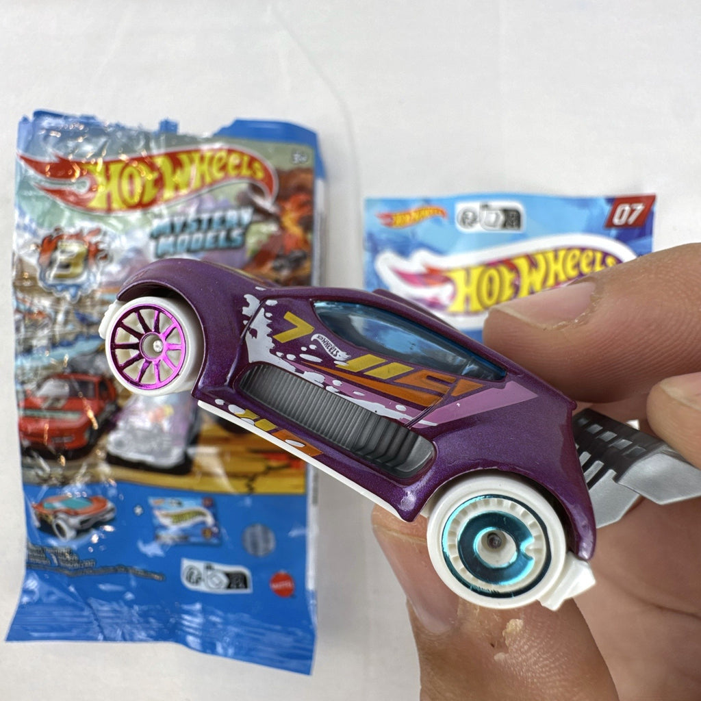 Hot Wheels 1:64 scale Fast 4WD diecast car in metallic purple from Mystery Models Series 3 with original packaging