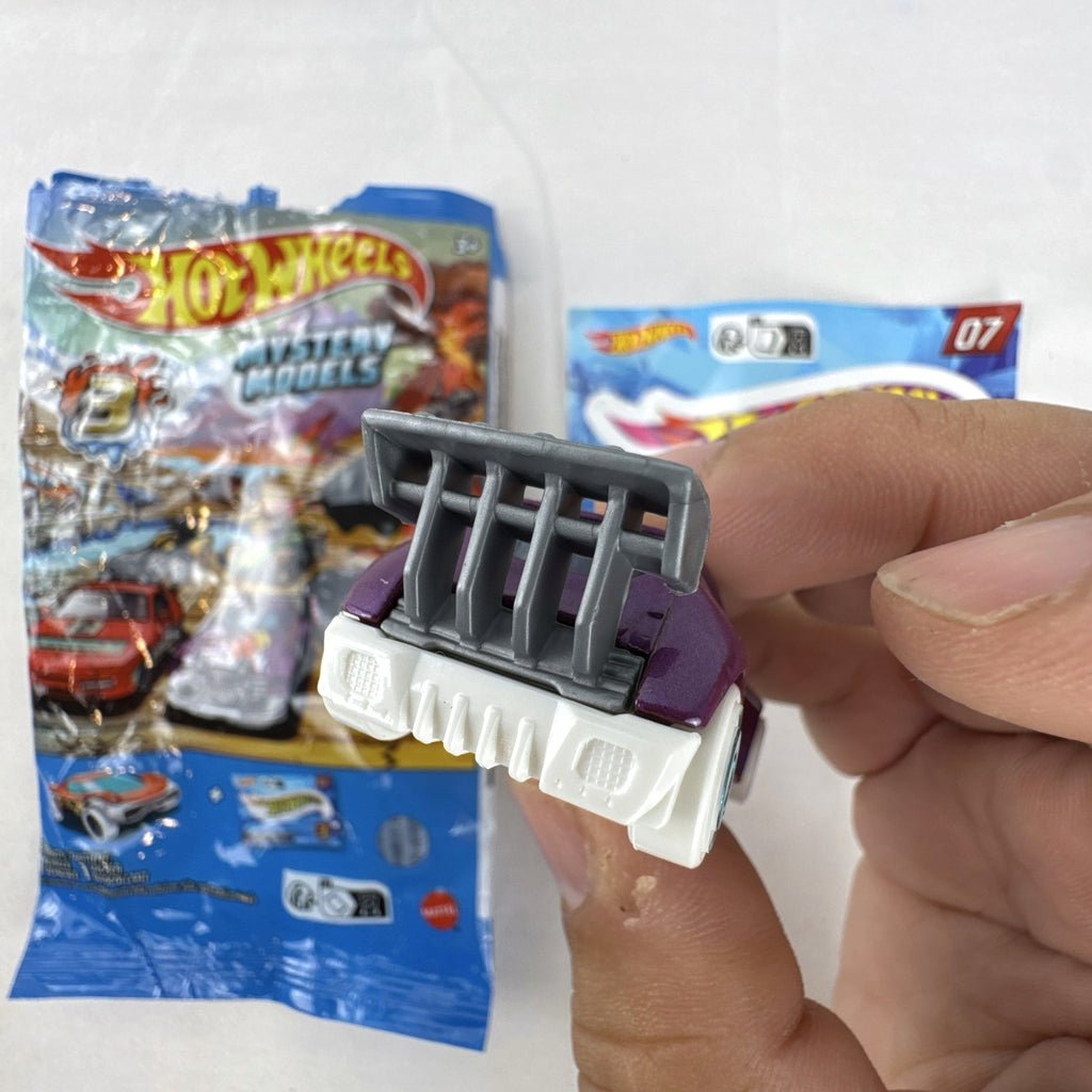Hot Wheels 1:64 scale Fast 4WD diecast car in metallic purple from Mystery Models Series 3 with original packaging