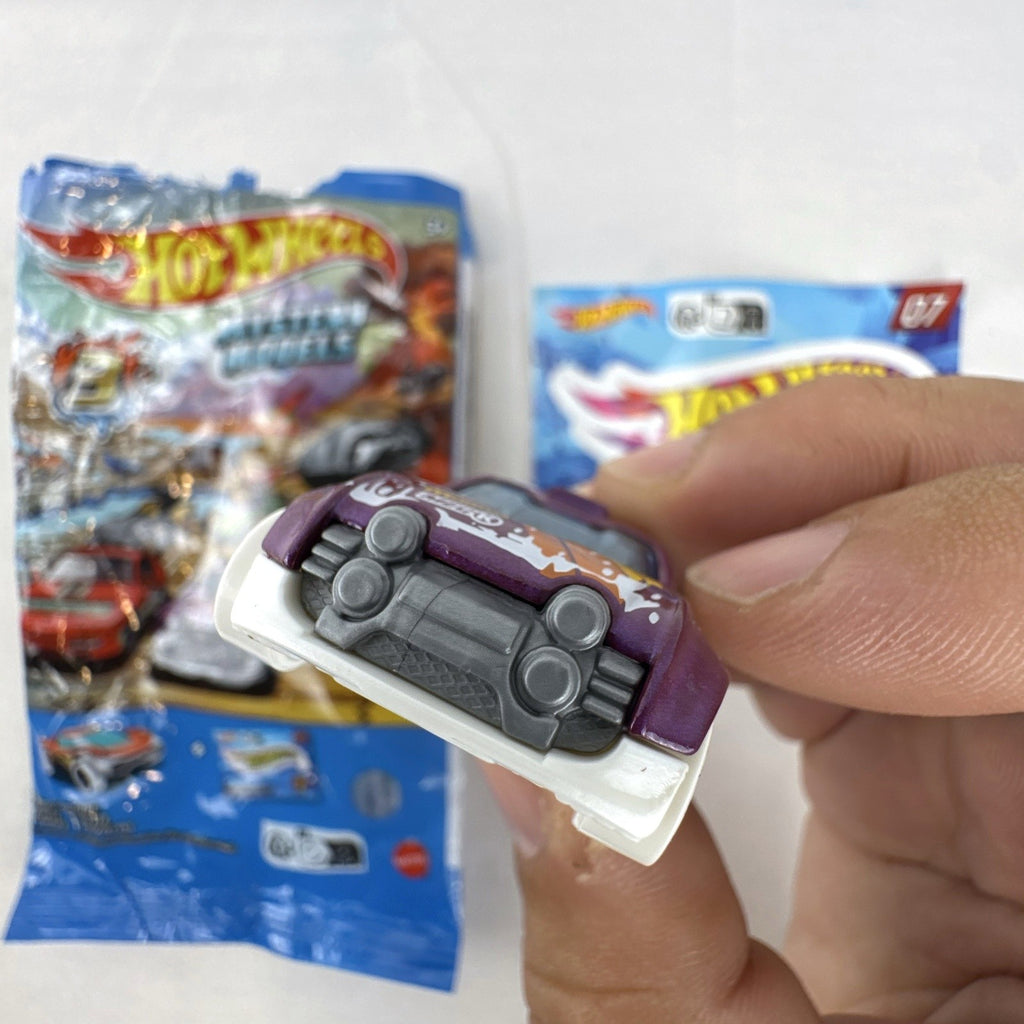 Hot Wheels 1:64 scale Fast 4WD diecast car in metallic purple from Mystery Models Series 3 with original packaging