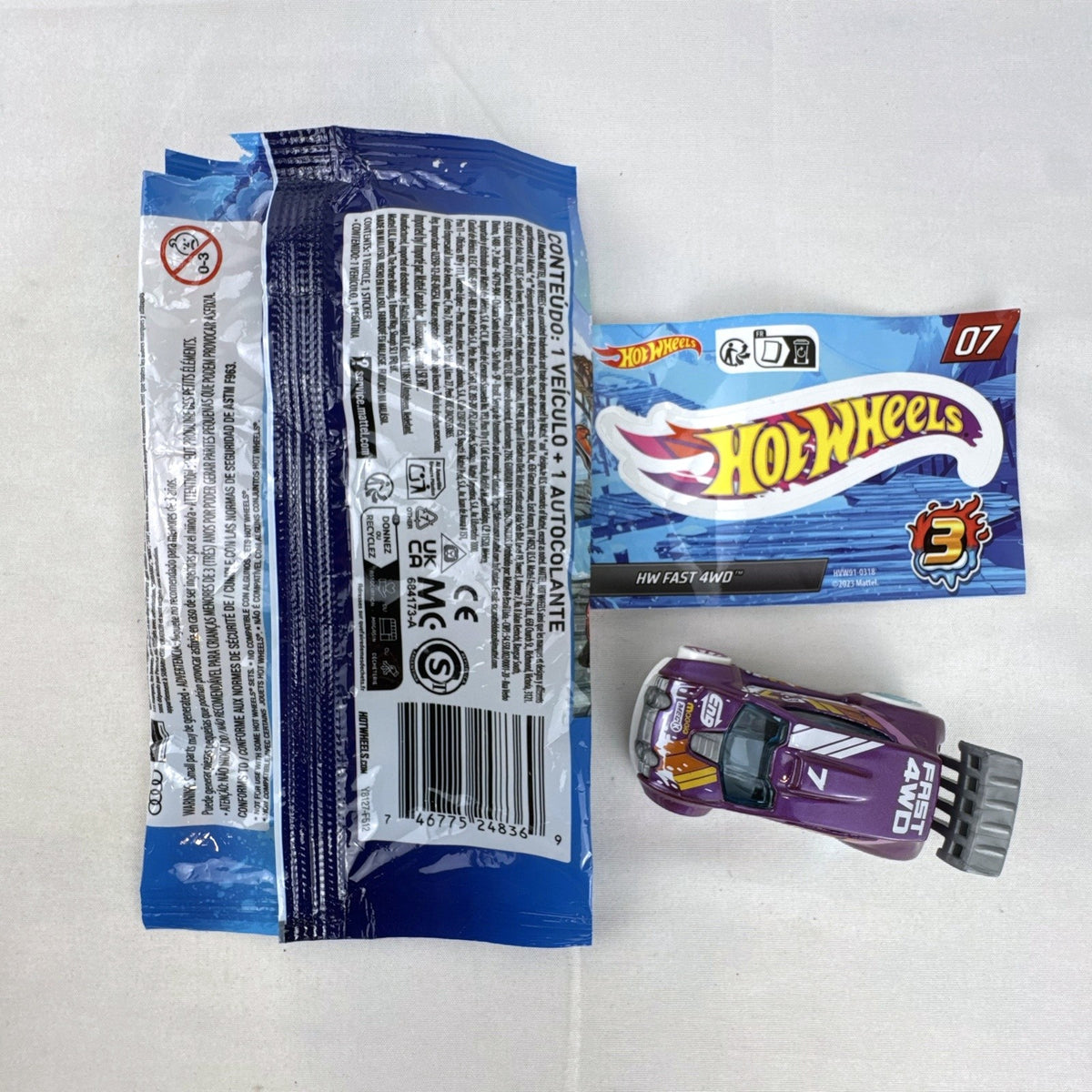 Hot Wheels 1:64 scale Fast 4WD diecast car in metallic purple from Mystery Models Series 3 with original packaging