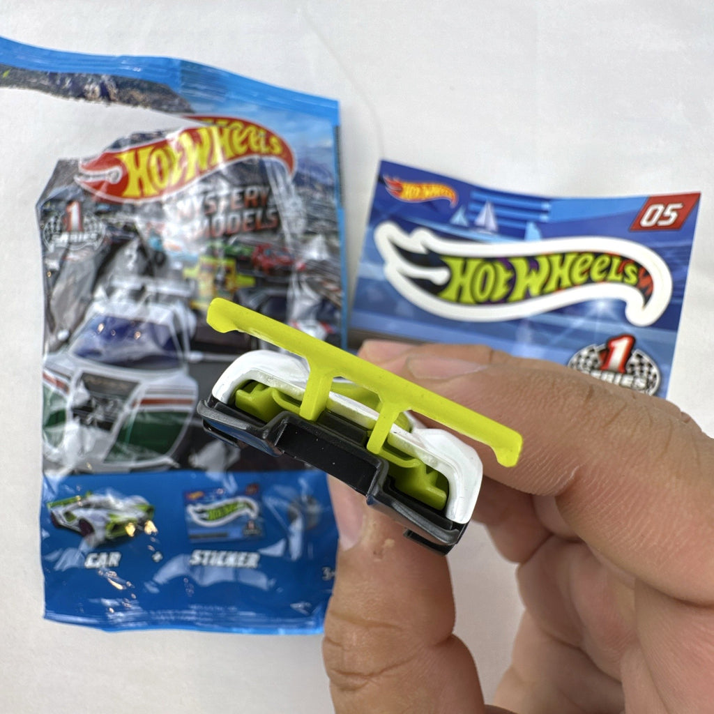 White Hot Wheels Mach Speeder diecast car Mystery Models #05 with purple graphics and lime green accents