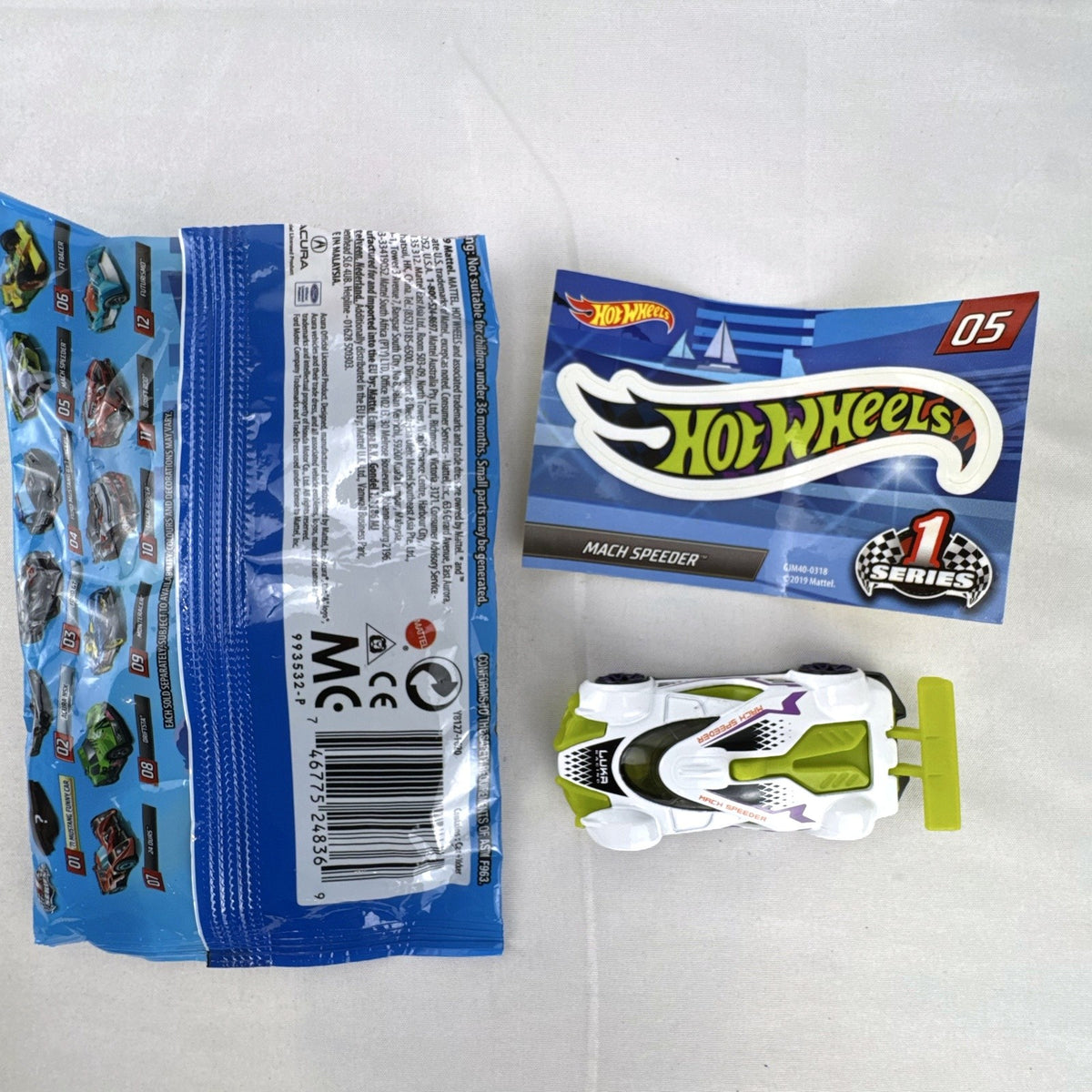 White Hot Wheels Mach Speeder diecast car Mystery Models #05 with purple graphics and lime green accents