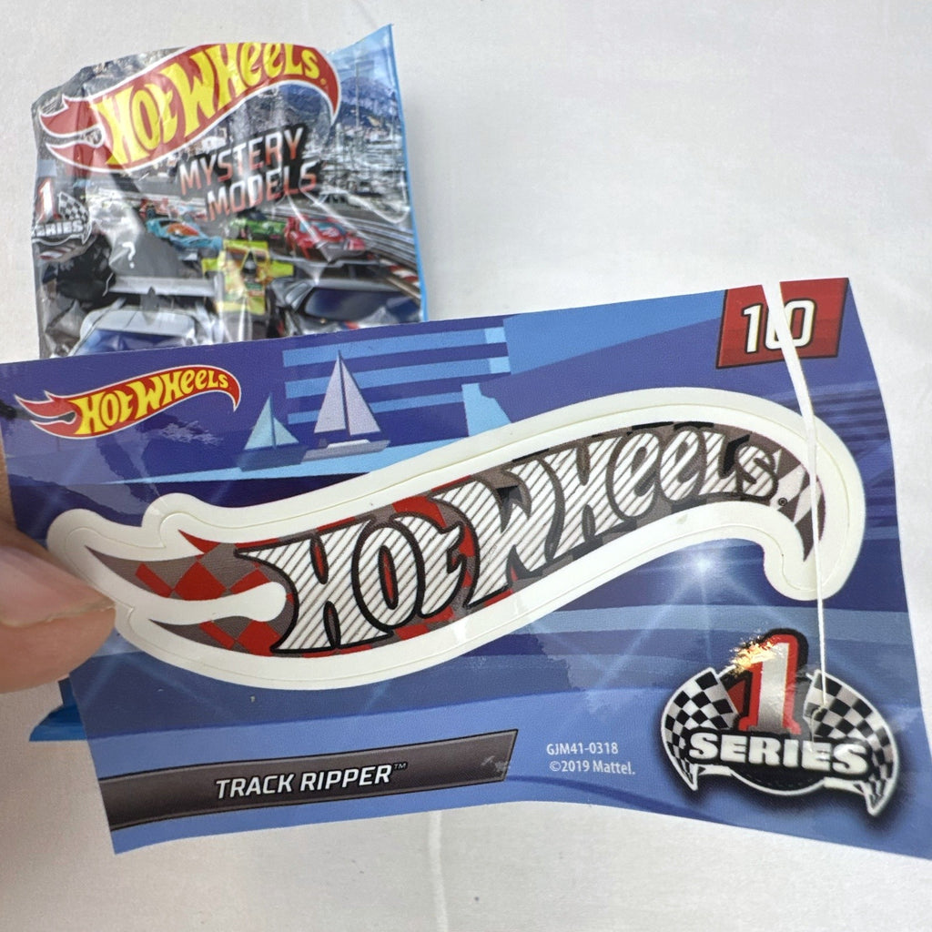 Hot Wheels Track Ripper 1:64 scale diecast car in silver with red racing graphics and matching #10 sticker.