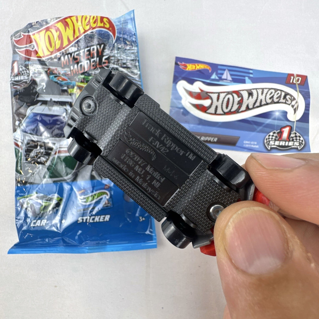 Hot Wheels Track Ripper 1:64 scale diecast car in silver with red racing graphics and matching #10 sticker.