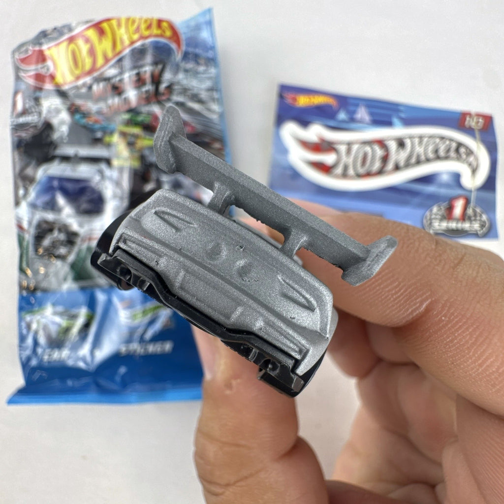 Hot Wheels Track Ripper 1:64 scale diecast car in silver with red racing graphics and matching #10 sticker.