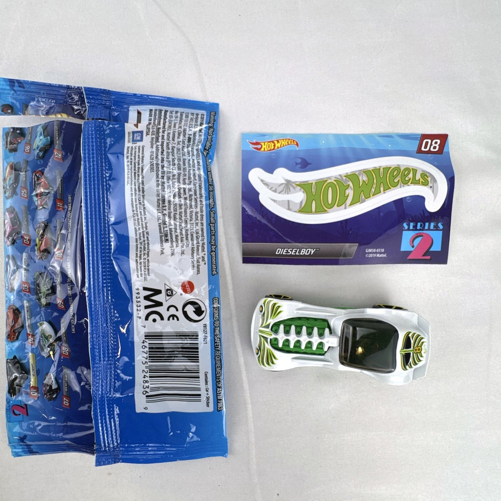Hot Wheels 1:64 scale Dieselboy diecast car in white and green with original 2020 Mystery Models Series 2 bag and sticker card.
