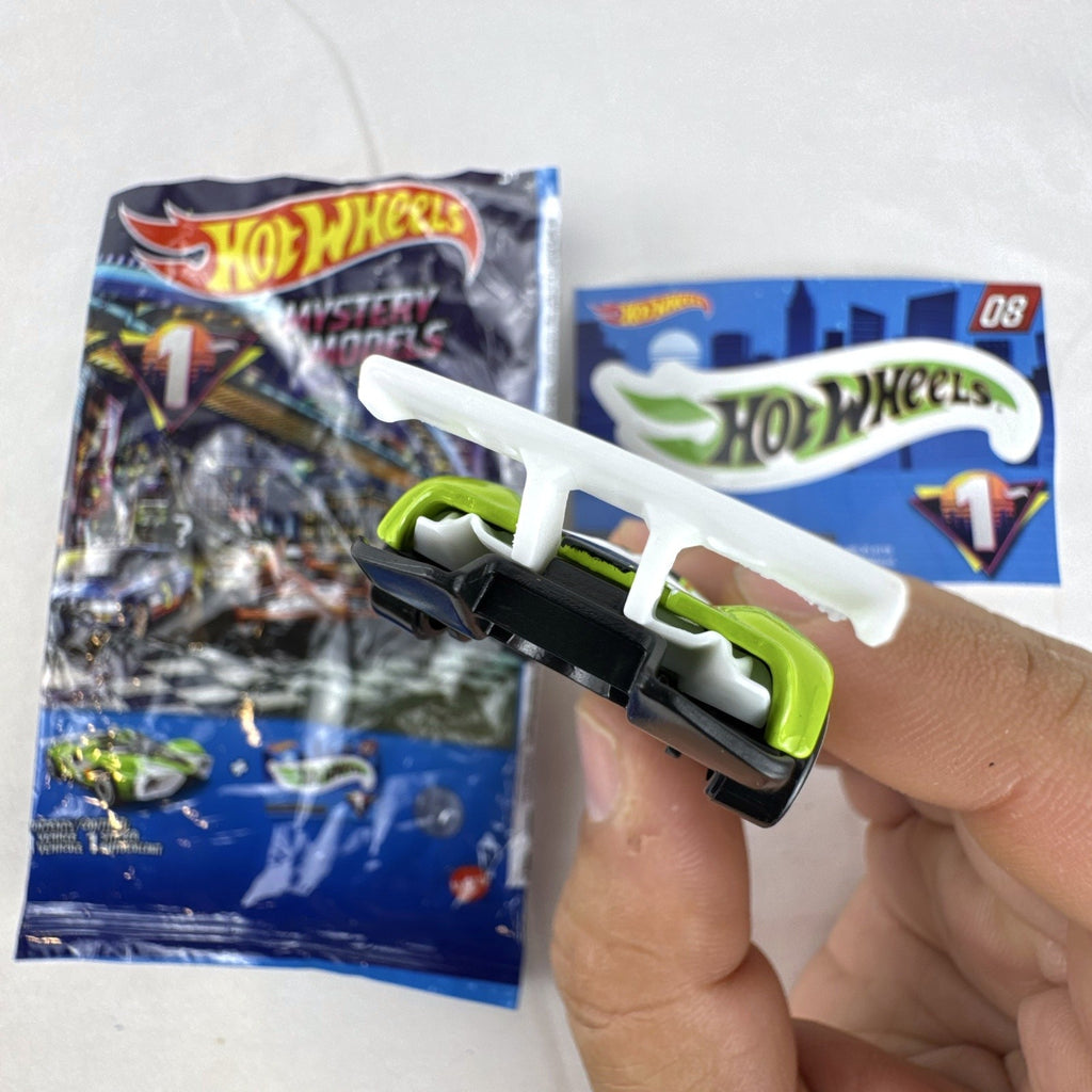 Hot Wheels 2021 Mystery Models Series 1 Mach Speeder #08 diecast car in bright lime green with matching sticker card.
