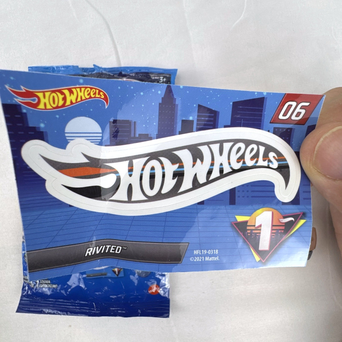 Hot Wheels 1:64 scale Rivited mystery models series 1 dark gray diecast car with exposed chrome engine and #9 graphics