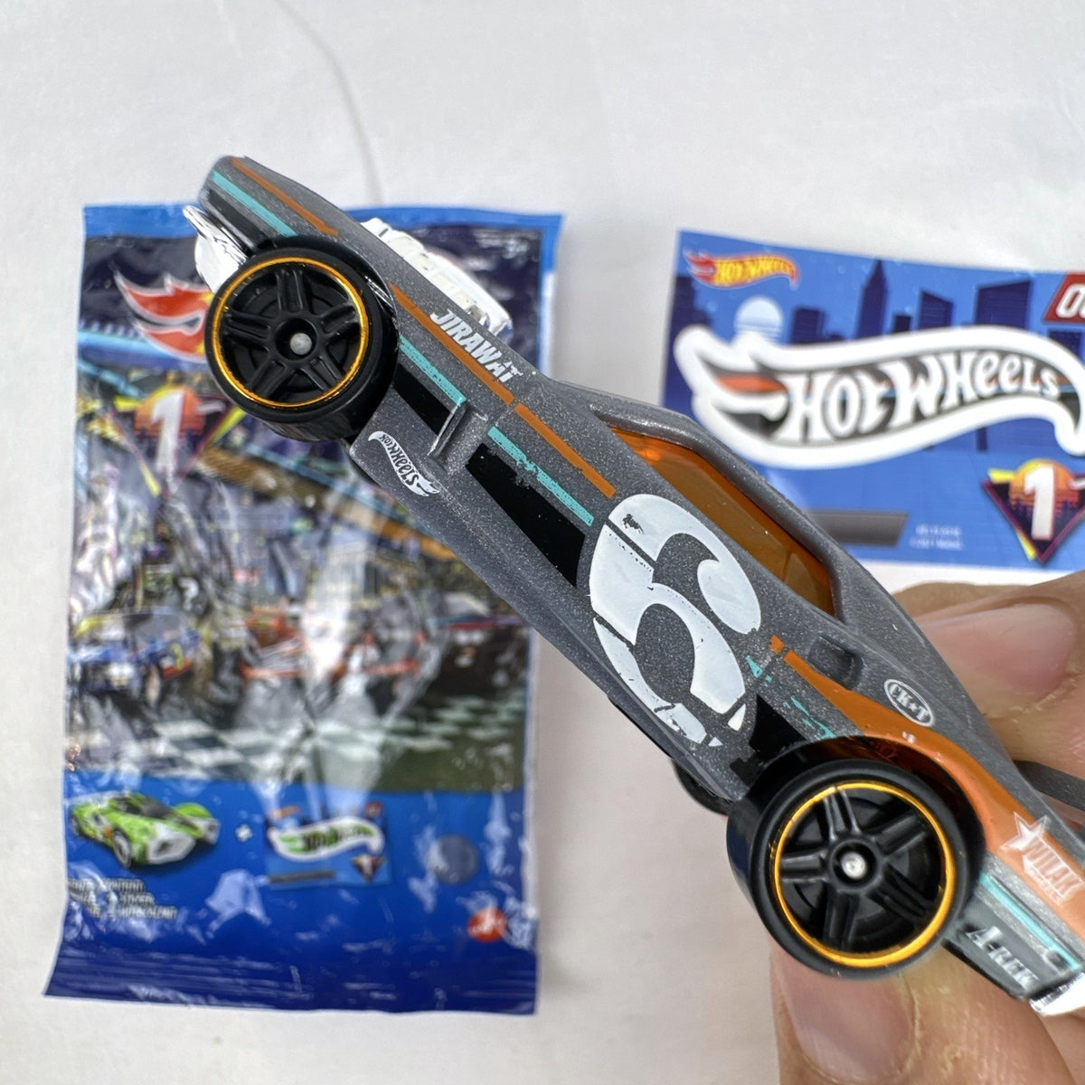 Hot Wheels 1:64 scale Rivited mystery models series 1 dark gray diecast car with exposed chrome engine and #9 graphics