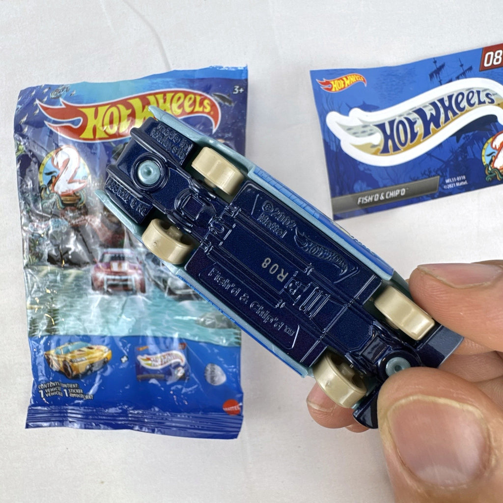 Hot Wheels Fish'd & Chip'd 1:64 scale diecast car in light blue with Union Jack roof graphic and bonus sticker.