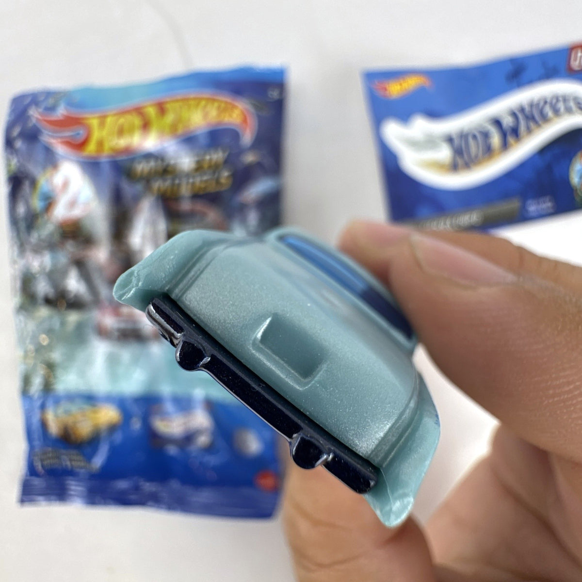 Hot Wheels Fish'd & Chip'd 1:64 scale diecast car in light blue with Union Jack roof graphic and bonus sticker.